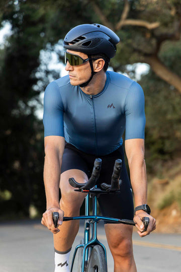 frontal view of man cycling in eldhraun classic cycling jersey