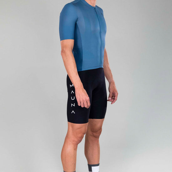 full body front side view of man wearing eldhraun classic cycling jersey