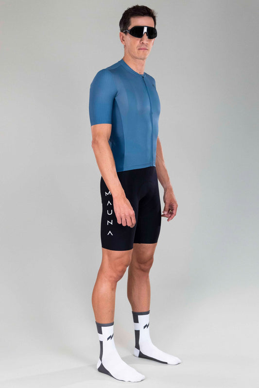 full body front side view of man wearing eldhraun classic cycling jersey