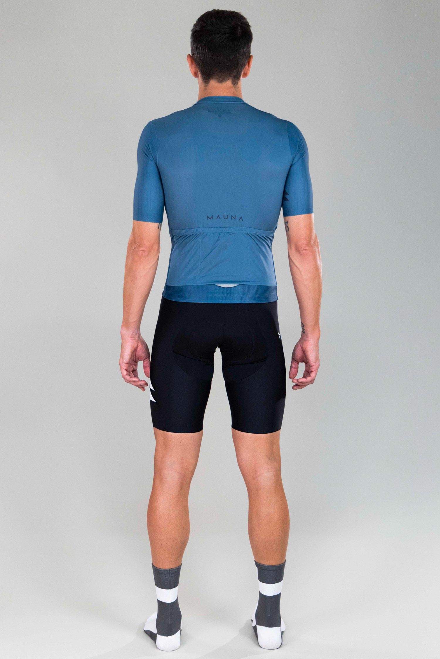 full body back view of man wearing eldhraun classic cycling jersey