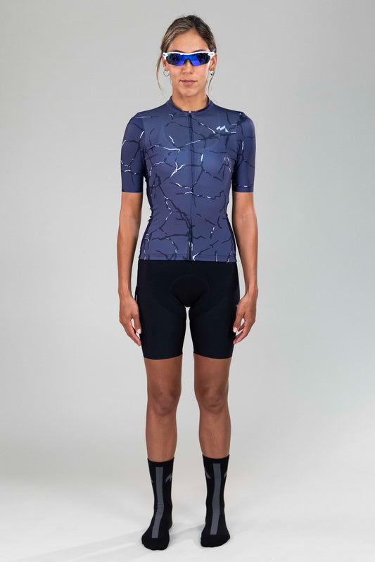 full body frontal view of woman wearing Eldhraun force cycling jersey