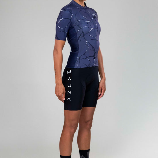 Front left-side view of woman wearing Eldhraun force cycling jersey