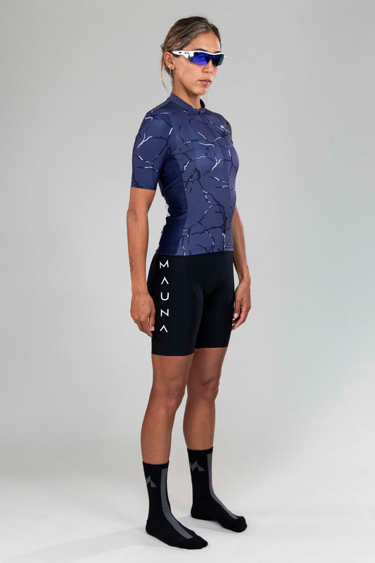 Front left-side view of woman wearing Eldhraun force cycling jersey
