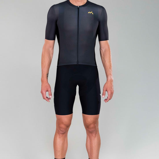 frontal full body view of man wearing Eldhraun force cycling jersey in black