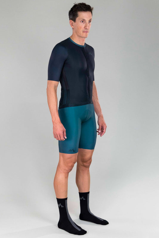 full body front side view of man wearing mna metsa cycling jersey