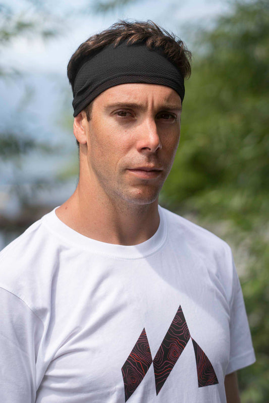 man wearing black performance athletic headband